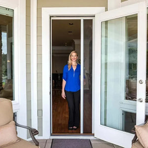 Genius Milano 100 retractable screen door installed on a sliding door frame with smooth gliding mechanism and magnetic seal