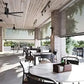 Motorized patio and garage screens installed on outdoor patio providing shade and bug protection