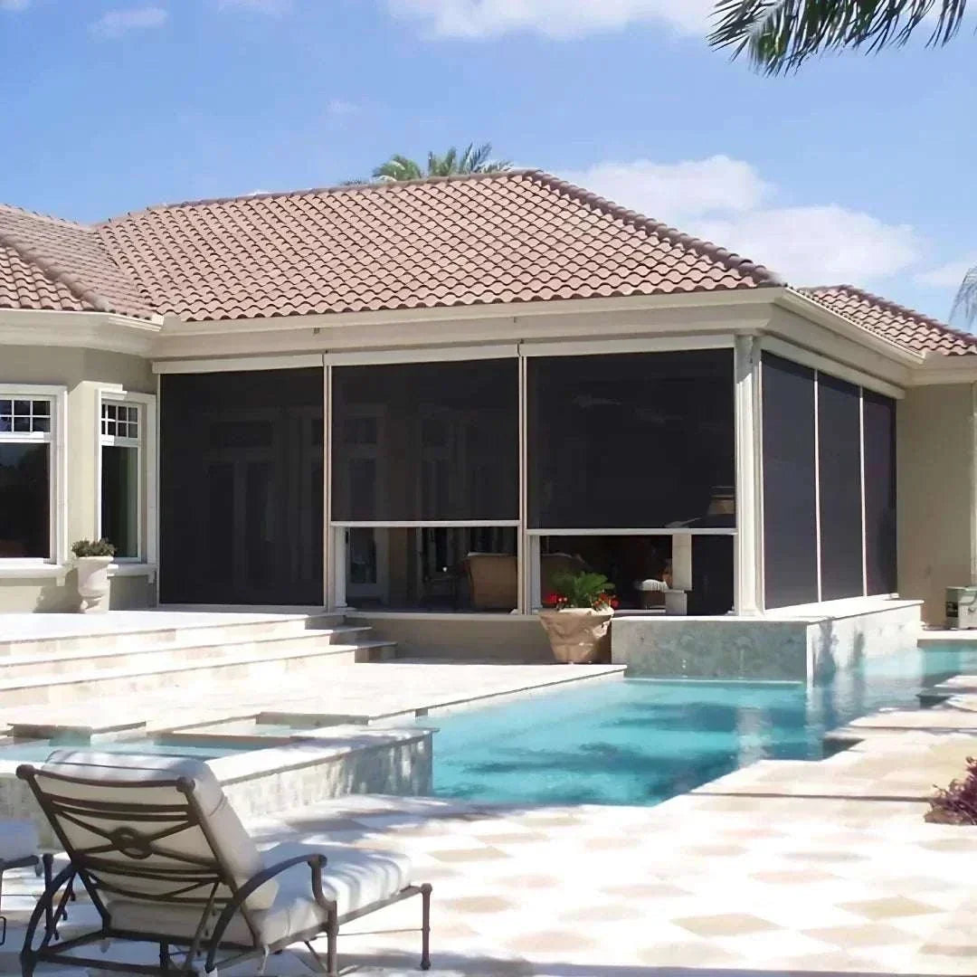 Motorized patio and garage screens installed on outdoor patio creating a bug-free, sun-shielded living space